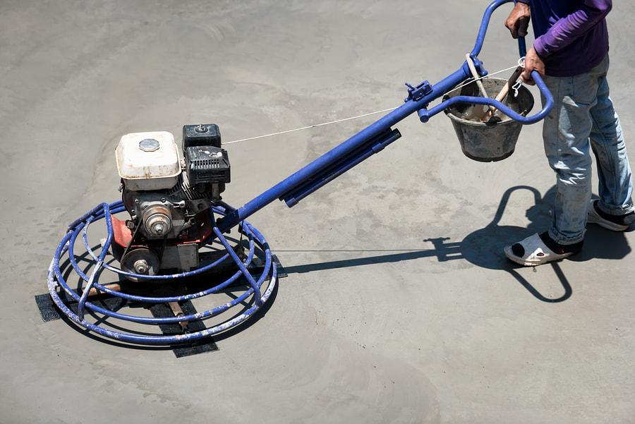 Heavy duty machine smoothing a concrete floor