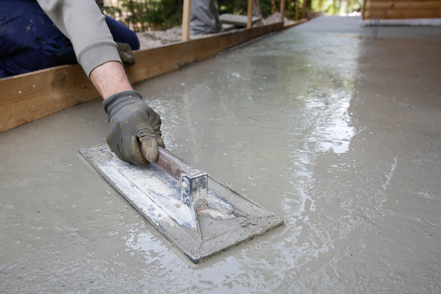 Concrete being prepared ready for stamping and staining